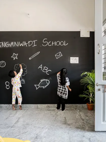 A school should be a canvas for creativity. For the Anganwadi project, I designed an entire wall as a blackboard. This simple feature transforms the room into an interactive learning zone, encouraging children to express themselves and making education a joyful, hands-on experience.