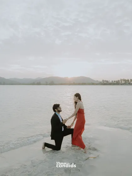 A beautiful proposal moment on a sandbar at sunset. A perfect shot for a pre-wedding or engagement session.
