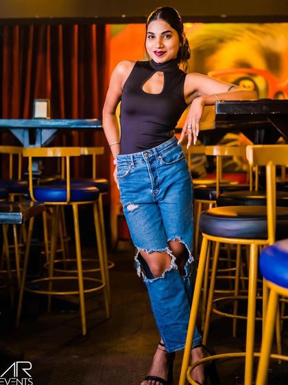 A guest posing at the bar.