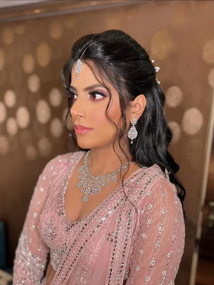 My gorgeous bride Garima for her engagement. We opted for a soft pink smokey eye and a half-up hairstyle that looked both modern and elegant.
