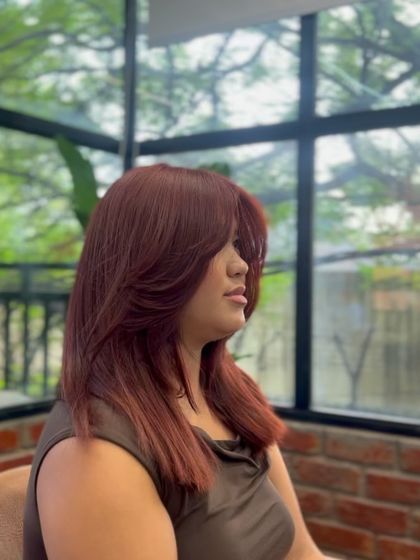 The butterfly cut from another angle, highlighting the movement and body this style provides.