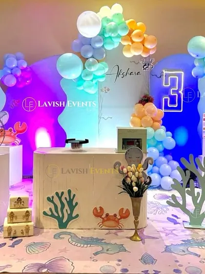 Dive into this amazing ocean-themed party, complete with wavy backdrops, a custom-printed floor mat, and cute sea creature props like crabs, seahorses, and shells.