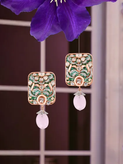 Each reflection in these earrings tells a story of joy and timeless grace. I've combined diamonds, emeralds, and a blush of pink gemstones to create a piece that feels both classic and fresh.