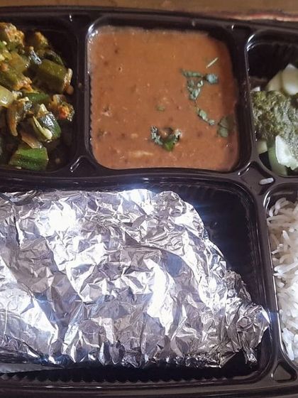 A tasty thali with dal makhni and bhindi do pyaza. The creamy dal pairs wonderfully with the crisp and flavorful okra.