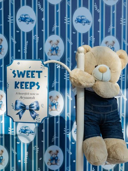 A 'Sweet Keeps' station where guests can leave a heartfelt note for the birthday boy. The custom signage and denim-clad teddy bear are perfectly on-theme.