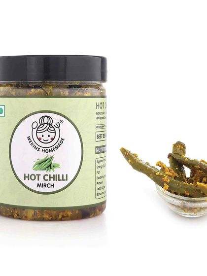 A jar of our Hot Chilli Mirch achaar with a small bowl, ready to be added to any meal for an extra kick.