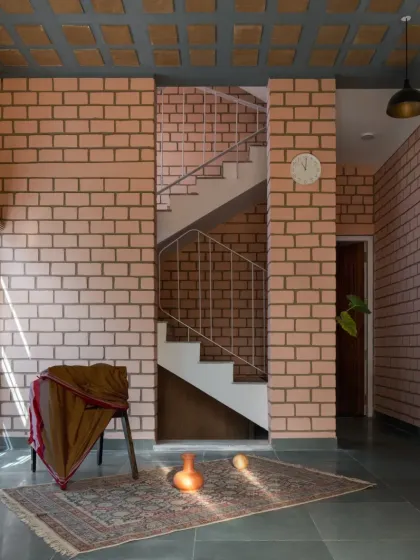 This home showcases my commitment to sustainable building. The walls are made from Compressed Stabilized Earth Blocks (CSEB), and the ceiling is a filler slab, techniques that reduce concrete usage and provide excellent thermal insulation.