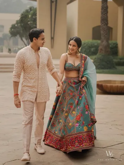 A candid walking shot of the couple. Shubhangi's makeup looks effortless and chic.