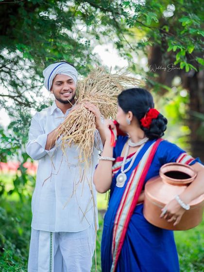 Playful interactions are the heart of a great pre-wedding shoot. Here, the couple shares a lighthearted moment with a bundle of hay, showcasing their fun-loving chemistry.