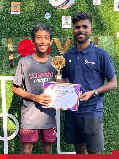 Siddhant Sunil Thayyil receives the Man of the Match award from his coach for his outstanding performance.
