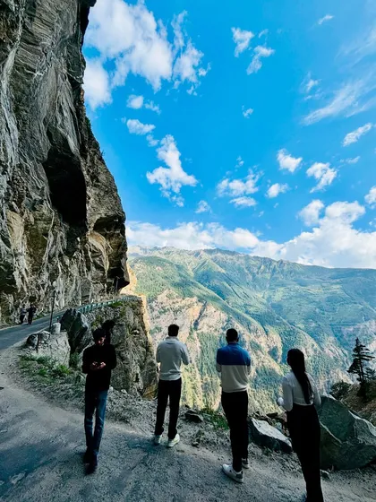 A few travelers taking a moment to absorb the insane views from the side of the road. Sometimes you just have to stop and stare at the sheer scale of the Himalayas.