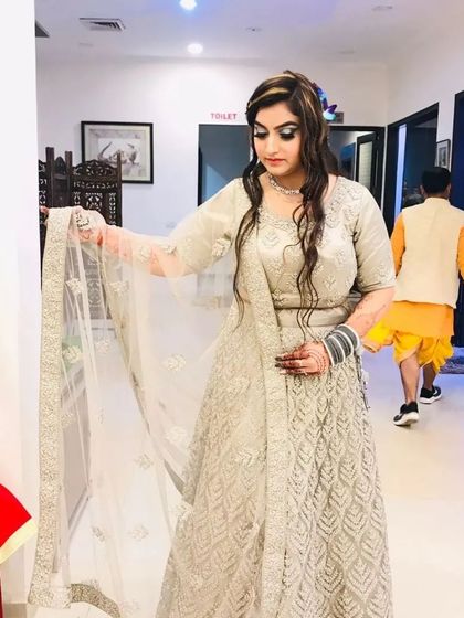 Another client wearing the ivory chevron lehenga, showing its versatility and appeal.