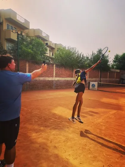 Here, Coach Todd Clark is using technology to conduct a serve speed test with one of our young athletes. We analyze the data to help players adjust their power and technique to achieve the perfect balance of speed and accuracy.
