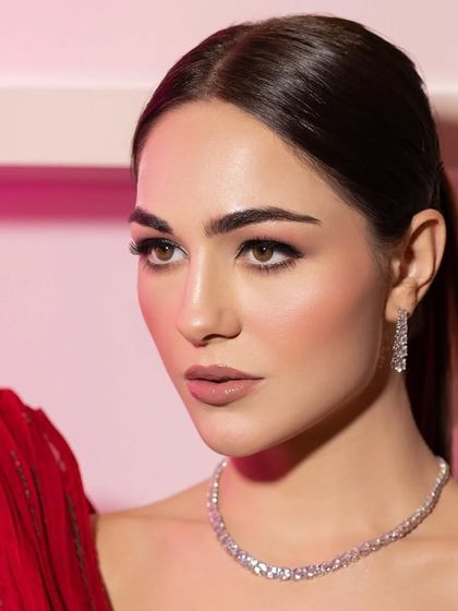 The era of the glam look. A close-up on a model's flawless makeup.