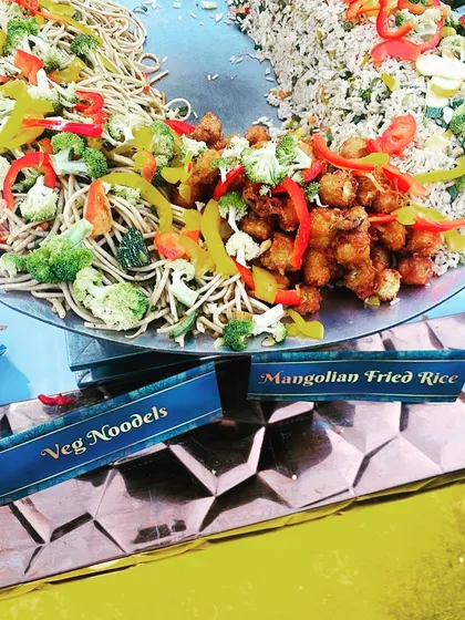 This is my live Chinese food station, featuring freshly tossed veg noodles and flavourful Mongolian fried rice. It's a popular choice for adding an international flair to any party menu.