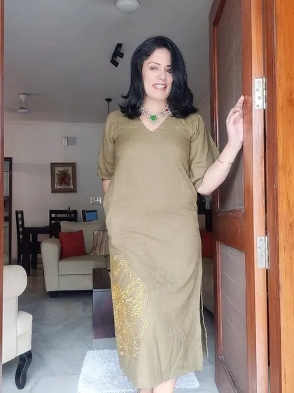 A full-length shot of my olive green birthday dress, showing the subtle embroidery detail.