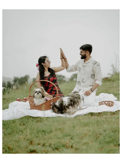 A perfect picnic for four. I believe your pets are family, and this fun, relaxed pre-wedding shoot with their furry friends shows that love stories are even better with paws included.