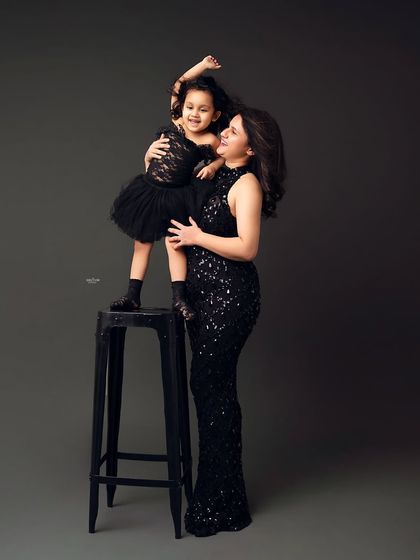 A glamorous mother-daughter portrait. The little one's energy is just infectious!