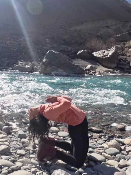 Embracing the divine feminine energy with a heart-opening camel pose by the river. A perfect way to honor both Mahashivratri and Women's Day.