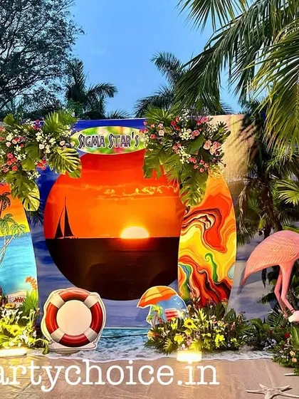 For this corporate poolside party, we created a complete beach-themed environment. The setup features a custom sunset backdrop, surfboard props, flamingo figures, and tropical foliage to create an immersive and fun atmosphere for guests.