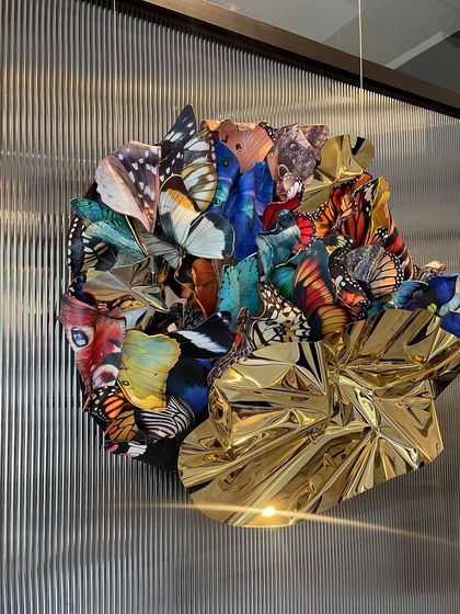 A view of "Emphemeral Reflections" under gallery lighting, which brings out the interplay of light and shadow.