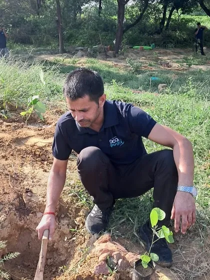 A volunteer from Bacardi digs a pit for a new sapling. The hard work of our partners is essential for preparing the ground for new life.