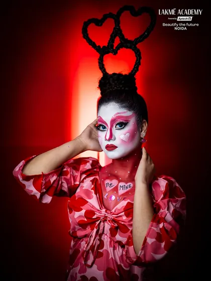 A full-length view of a whimsical Valentine's character. The "Be Mine" text and heart-themed outfit complete this playful and artistic look.