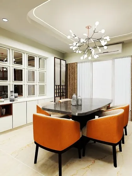An elegant dining space featuring a six-seater table with orange upholstered chairs. The custom crockery unit includes mirrored shutters that add depth and reflect the light from the modern chandelier.