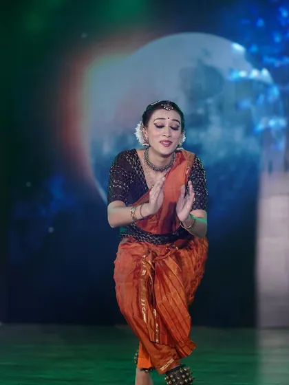 From a performance exploring the theme of motherhood. This pose, with hands in a gesture of prayer, conveys the devotion and gentle love of a mother putting her child to sleep.
