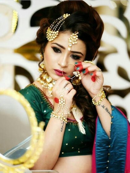 We offer pieces from a long list of top designers like Manish Arora, Varun Bahl, and Shantanu & Nikhil. This image captures the essence of getting ready for a big event in a beautiful designer outfit.