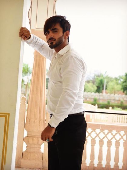 Styling for male artists is also a key part of my service. Here, I styled Harsh Gahlot in a classic white shirt and black trousers for a sharp and timeless look.