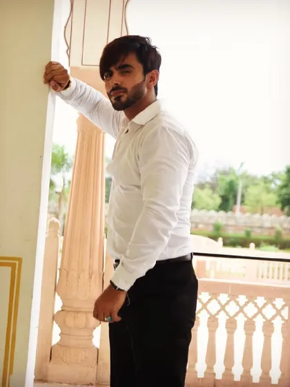 Styling for male artists is also a key part of my service. Here, I styled Harsh Gahlot in a classic white shirt and black trousers for a sharp and timeless look.
