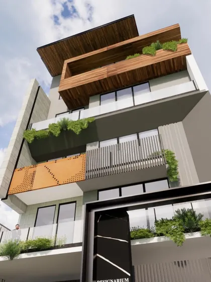 A low-angle perspective of the modern facade, highlighting the cantilevered wooden box on the upper floor and the detailed perforated screen. This view emphasizes the building's vertical elements.