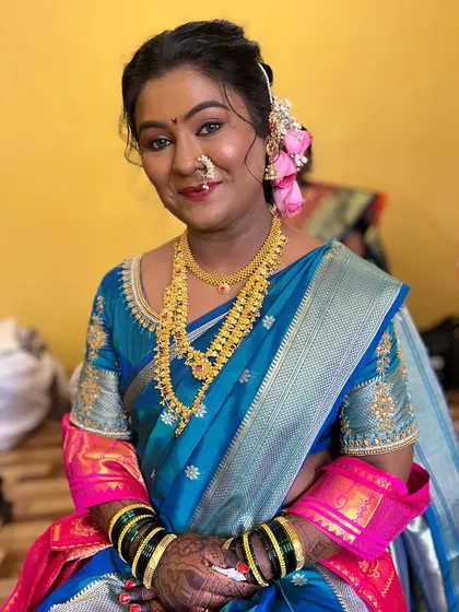 A different saree look for the same bride, showing versatility in styling.