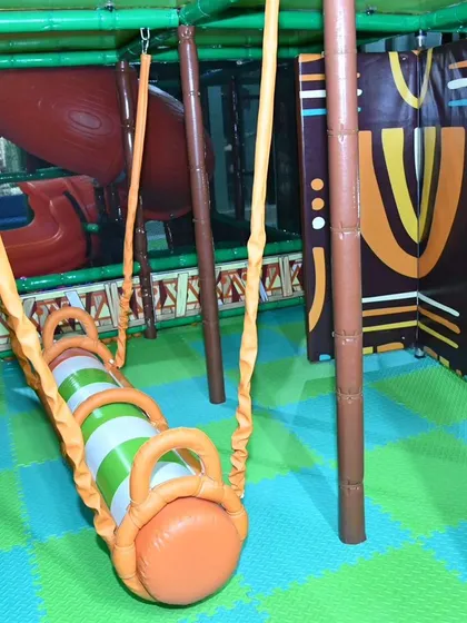 This hanging roller provides a unique balancing challenge for kids. It's one of the many elements in our obstacle course designed to improve motor skills in a fun way.