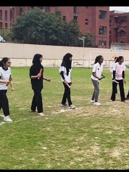 Teamwork in action during the relay race at the Girls' Hostel Annual Sports Meet. These events foster both competitive spirit and camaraderie among students.