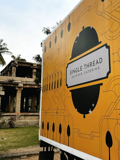 Our branded catering truck parked at the historic Hampi site. This powerful image demonstrates our logistical capabilities and our commitment to creating unique events in extraordinary locations.