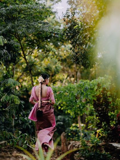 A duplicate of ID 229, this portrait captures a bride's graceful walk through a lush green path.