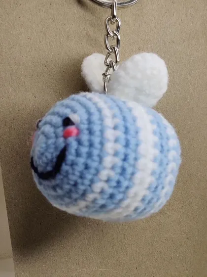 My super popular bumblebee keychains. They come in the classic yellow and black, but I also make them in fun colors like pink, blue, and purple.