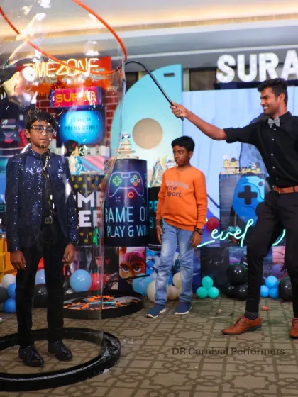 A young guest is completely captivated inside a giant bubble at his gaming themed birthday party. Our bubbleologist creates a fun and safe experience, making the birthday boy the star of the show.