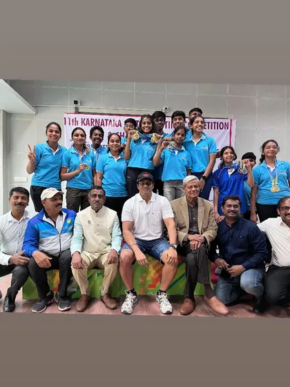 A group photo with all our medal winners and supporters at the 11th Karnataka State Shooting Competition, celebrating our overall success.