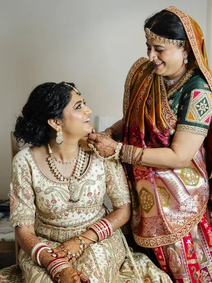 These heartwarming photos show the bride with her parents. I created coordinated, elegant makeup and hair for both the bride and her mother, ensuring everyone felt their best on this special family day.