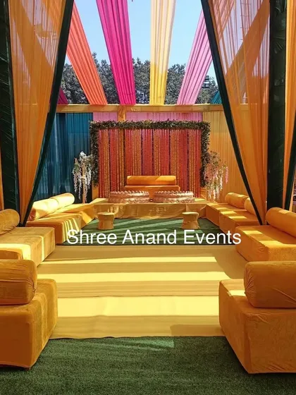 A wide view of the Haldi ceremony seating area, with vibrant yellow decor creating a cheerful and festive atmosphere.