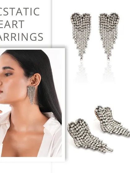 The Ecstatic Heart Earrings are a modern statement piece, featuring a heart-shaped stud with a shimmering metallic fringe.