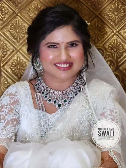 A beautiful portrait of our Christian bride Pranali. The simple veil and glowing makeup create a look of pure elegance.