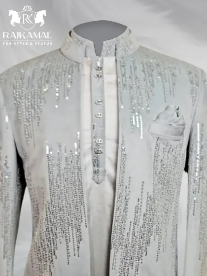 A front-on close-up of the sequined white jacket, paired with a matching kurta and pocket square.