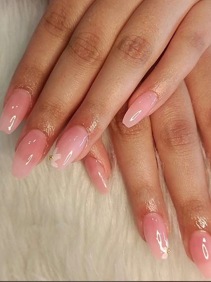 A close-up of the delicate and subtle floral nail art.