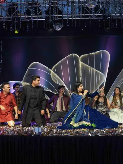 The grand finale of a family dance performance, with me cheering everyone on. It's all about creating a supportive and high energy atmosphere.