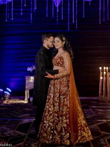 A romantic portrait of Neha and Vivek at their Sangeet. This shot captures a quiet, intimate moment between the couple amidst the high-energy celebration.