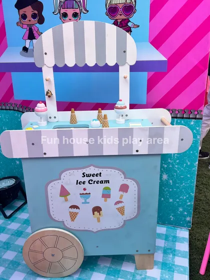 The adorable pastel-colored wooden ice cream cart, stocked with play ice cream cones and popsicles for sweet, imaginative fun.